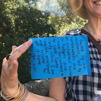 image of person holding flag with personal story written on it